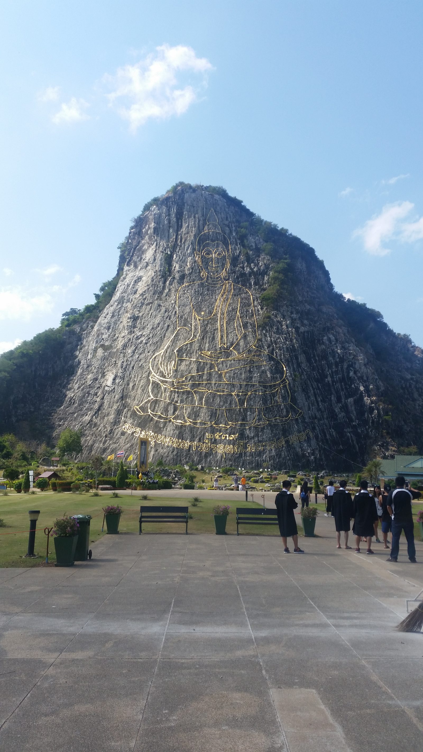 Row of golden Buddha statues at a temple in northern Thailand