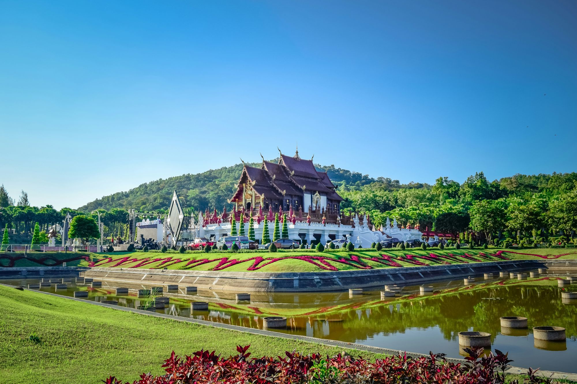 A winding mountain road through the green hills of northern Thailand